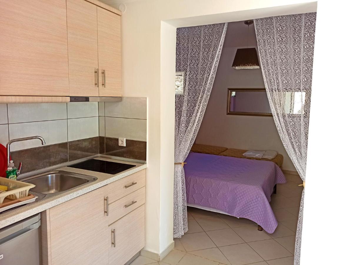 Dolphin Apartments Палеокастрица Экстерьер фото
